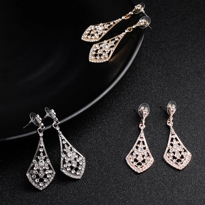 Sparkling geometric rhinestone dangle earrings set in gold, silver, and rose gold finishes
