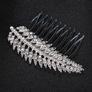 Detail of silver feather hair comb with crystals and ten tines for wedding styling