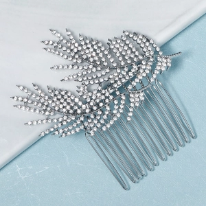 Detail of silver leaf bridal hair comb with brilliant rhinestones for wedding styling