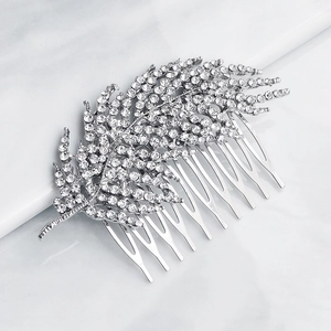 Detail of silver alloy bridal hair comb featuring leaf motifs and crystal rhinestones