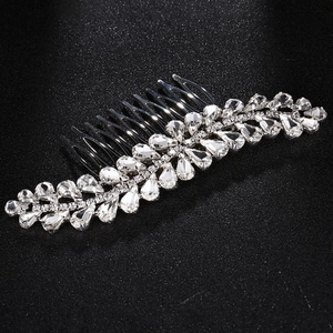 Detail view of radiant silver hair comb featuring sparkling rhinestone leaf patterns