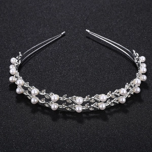 Detailed view of silver double-layered headband with elegant white pearls and tiny rhinestones
