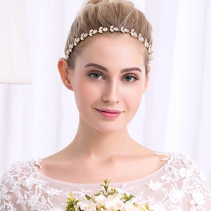 Luxurious bridal headband with sunflower rhinestones and gold leaf branch design for weddings
