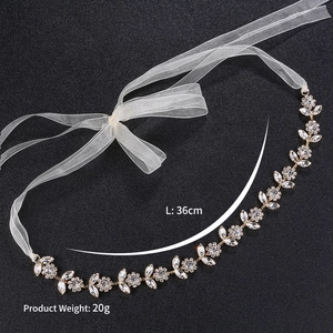 Detail of luxury bridal headband with sunflower rhinestones and ivory chiffon ties