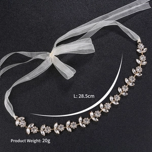Luxurious rhinestone sunflower bridal headband with gold base and white chiffon ribbons