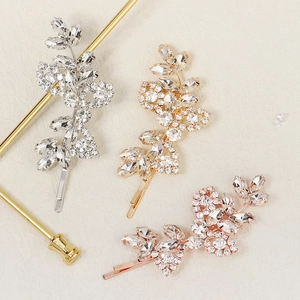 Elegant leaf hair clips set with rhinestones in gold, silver, and rose gold finishes