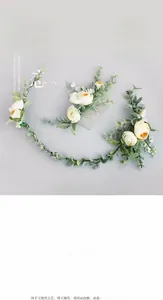 Detail of handmade bridal hair comb and floral headband set with cream flowers