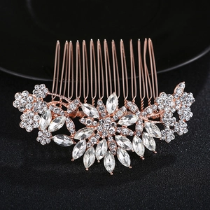 Detailed close-up of rose gold floral hair comb with sparkling rhinestones and crystals