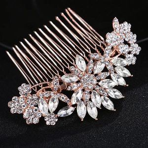 Elegant rose gold bridal hair comb with shimmering floral rhinestones on black background