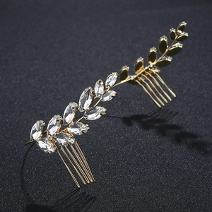 Detail of golden olive leaf bridal hair comb with sparkling marquise rhinestones