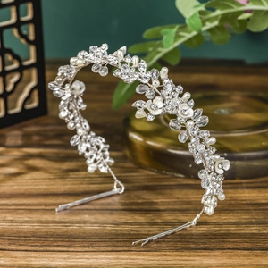 Elegant bridal crystal headband with silver leaves and pearls for wedding hairstyles