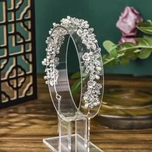 Exquisite silver bridal headband with crystal leaves and white enamel flower decorations