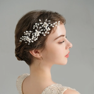 Handmade bridal hair pin with white pearls and silver crystals for wedding hairstyles