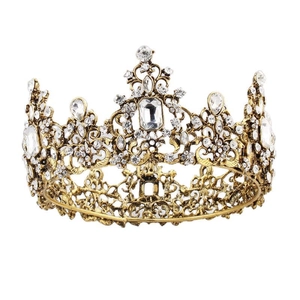 Vintage Baroque gold tiara with intricate filigree and sparkling white rhinestones