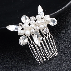 Elegant silver bridal hair comb with white pearls and sparkling rhinestones for weddings