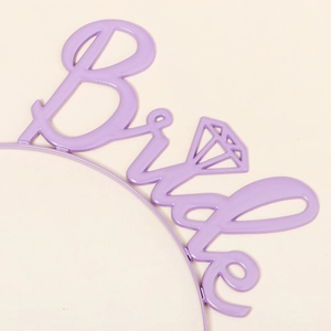 Detail of purple Bride lettering headband with diamond cutout for wedding events
