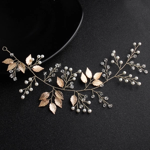 Detail of handmade gold leaf headband with delicate pearls and clear crystals