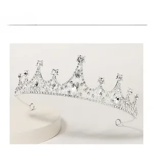 Detailed macro view of silver baroque tiara with sparkling rhinestones and crystals