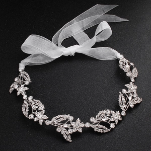 Detail of silver bridal headband featuring marquise rhinestones and white organza ribbons