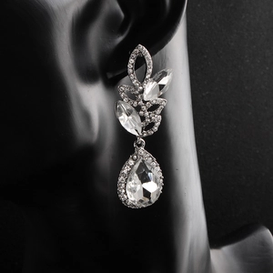 Detailed view of silver bridal earrings featuring water drop crystal and marquise stones