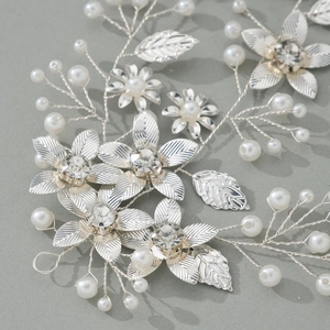 Vintage bridal headband with silver metal leaves, white pearls and sparkling rhinestones