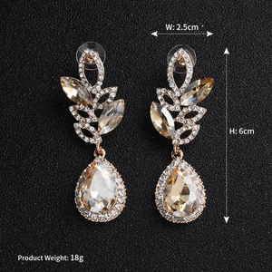 Macro shot of luxury marquise crystal drop earrings with size and weight dimensions