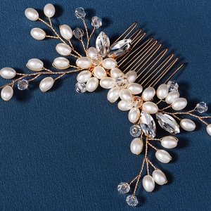 Handmade bridal hair comb with elegant white pearls and crystals on a gold wire base