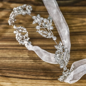 Elegant silver bridal headband with sparkling rhinestones and delicate organza ribbon