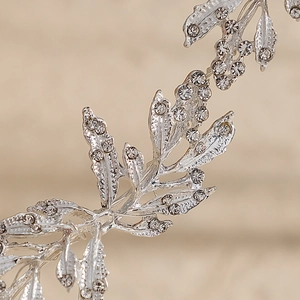 Silver bridal headband with alloy leaves and sparkling rhinestones for wedding styling