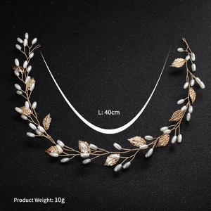 Detail view of 40cm handmade bridal hair vine with gold leaves and white pearls
