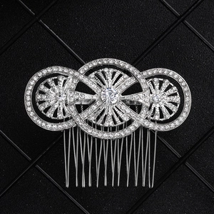 Macro detail of silver alloy hair comb featuring sparkling rhinestone encrusted circles