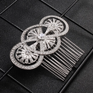 Detailed macro view of vintage silver alloy hair comb with sparkling rhinestones decoration