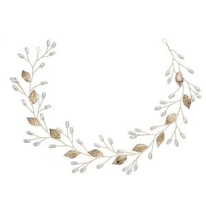 Handmade gold bridal hair vine with delicate metal leaves and white faux pearls
