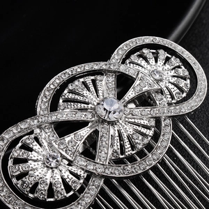 Macro shot of silver bridal hair comb with geometric circles and sparkling rhinestones