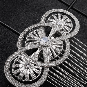 Detail view of vintage silver bridal hair comb with sparkly rhinestones for wedding styling