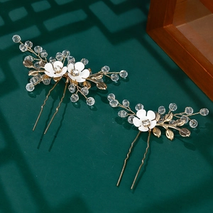Elegant gold U-shaped hair pins with white flowers and crystal leaf details set of two
