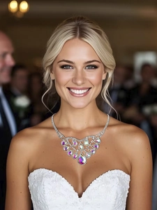 Detailed close-up of a luxury silver statement necklace with colorful teardrop rhinestones