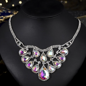 Luxury statement necklace with rainbow AB teardrop crystals on a black bust display