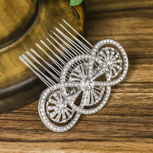 Silver bridal hair comb with vintage circular rhinestone design and ten metallic teeth