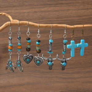 Bohemian turquoise drop earrings set with vintage feathers bull head and cross charms