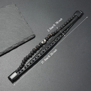 Close-up of men's layered leather bracelet with natural stone beads and metal clasp