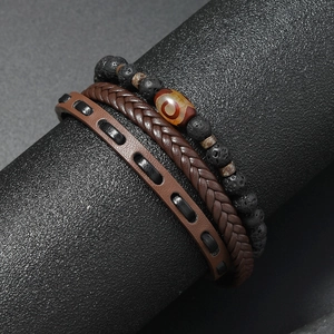 Detailed close-up of layered beaded stone and braided leather bracelets for men