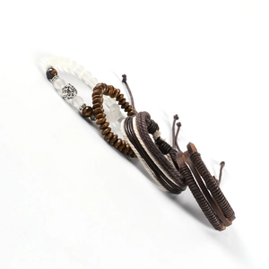 Detail view of layered leather bracelets with lion head charm and tiger eye stone beads