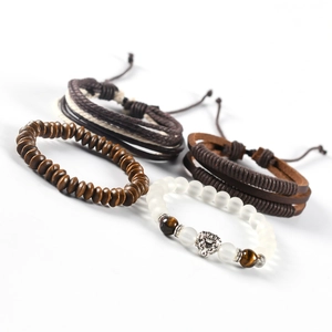 Detailed set of four men's bracelets featuring leather, wood beads, and a lion head charm