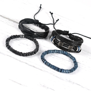 Detailed macro view of 4-piece set retro leather bracelets with beads and wings