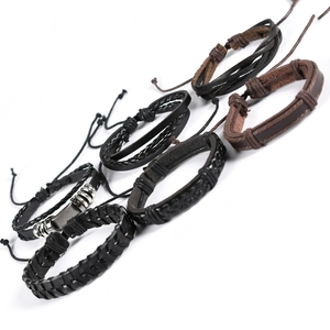 Detail view of 6-piece punk leather bracelet set with woven ropes and metal rings