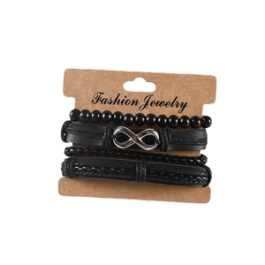 Set di 4 bracciali in pelle nera con simbolo dell'infinito su cartoncino espositivo