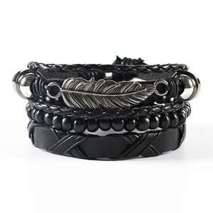 Bohemian multilayer black leather bracelet set featuring a vintage silver metal feather charm