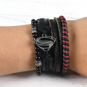 Detail of multi-layer leather bracelet featuring a vintage Superman shield metal logo