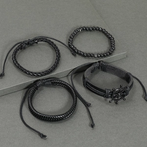 Men's 4-piece black leather beaded bracelet set featuring a metallic nautical helm charm